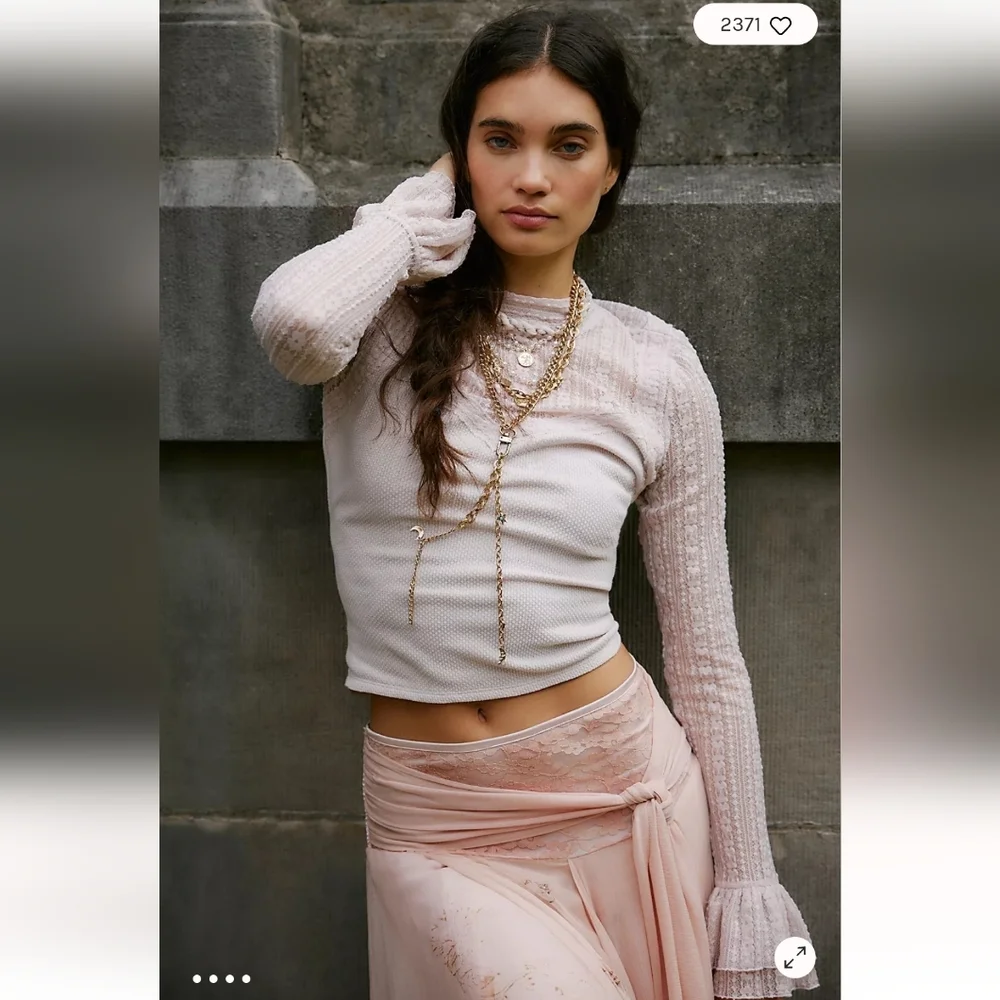 NWT Free People Mina Long sleeve lace top. Ruffle sleeves. Soft pink